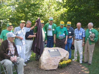 Photo taken 9/17/2006 of nine veterans of CCC with DNR Secretary Ron Franks unveiling the CCC Centennial Plage at Gambrill State Park