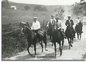 Warren G. Harding, Harvey Firestone, Thomas Edison and Henry Ford horseback riding  through Maryland during a camping trip in 1921.